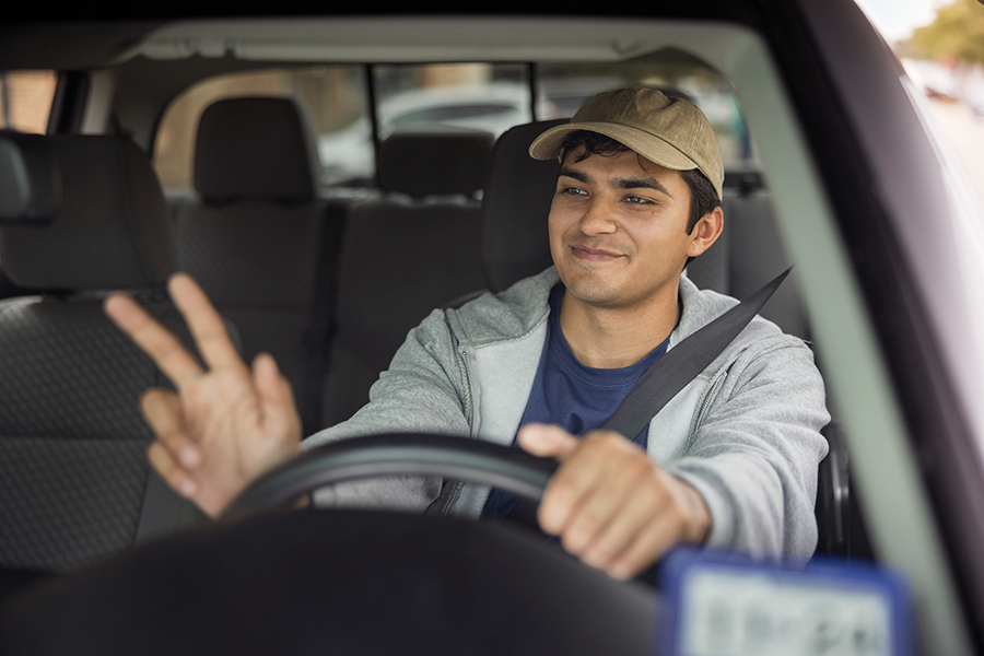Man waving in truck
