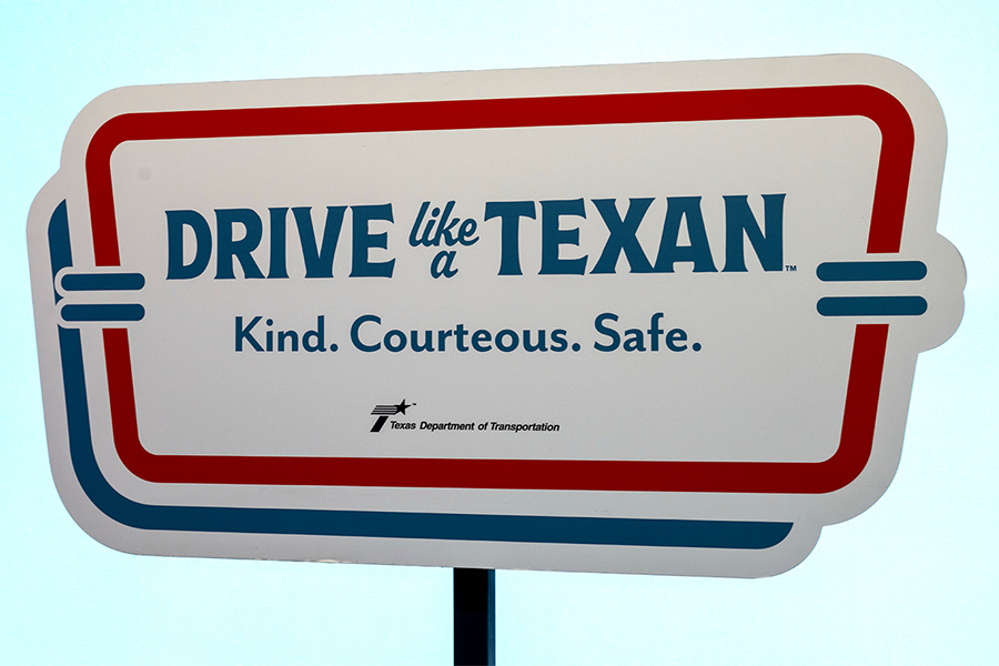 Drive Like a Texan sign