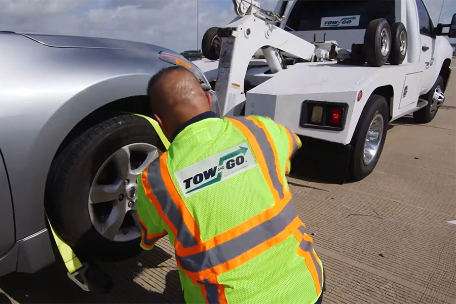 Tow and Go Program tow driver securing vehicle Tow and Go Program tow driver securing vehicle